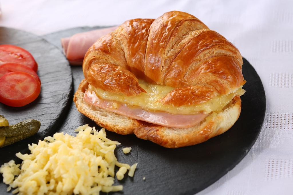 Ham and Cheese Croissant · Plain croissant with ham and cheese. Add-ons for an additional charge. 

