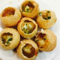 Paani Poori · Hollow dough balls stuffed with potatoes, chickpeas, onions, cilantro, tamarind and mint sau...