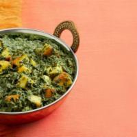 Saag Paneer · Crispy fried spinach with potatoes, chickpeas,onions and tomatoes with mint and tamarind sau...