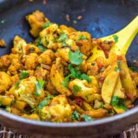 Aalo Gobi Masala · Fresh cauliflower and potatoes cooked in mildly spiced gravy. Vegetarian.