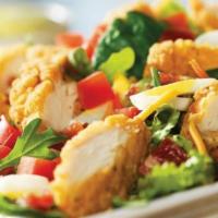 Crispy Chicken Tender Salad · Chicken tenders, hard-boiled eggs, hardwood-smoked bacon crumbles, tomatoes, croutons and Ch...