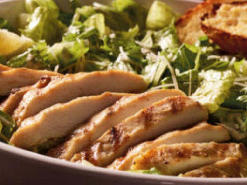 Mighty Caesar with Chicken · The king of all salads. Fresh, crisp romaine lettuce and shredded Parmesan cheese tossed with creamy Caesar dressing, topped with grilled chicken breast.
