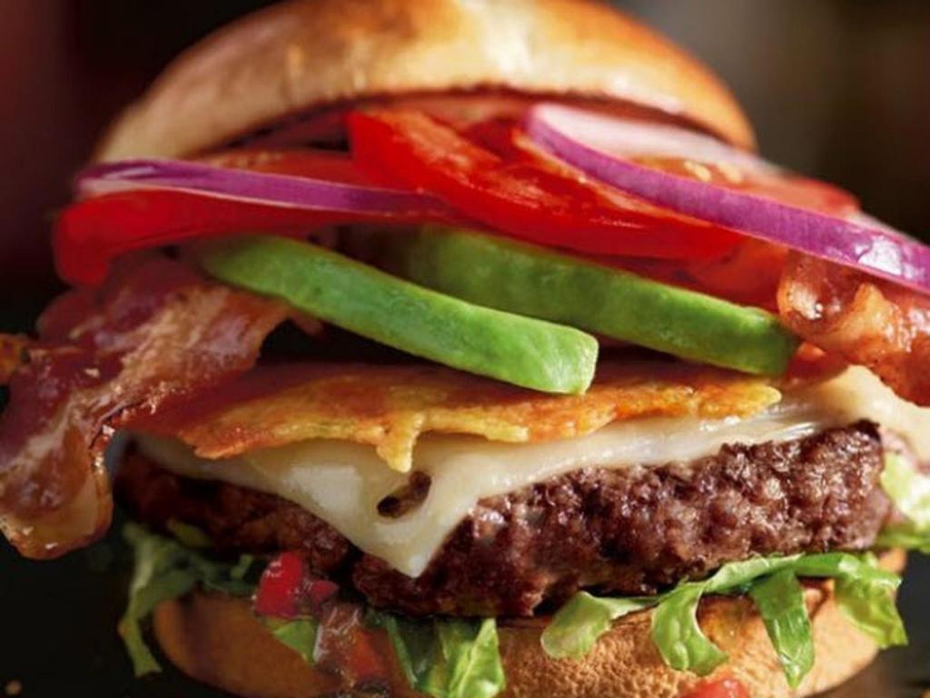 The Madlove Burger · Fall in love with this burger. Provolone and Swiss cheeses over a of gourmet beef patty topped with a Cheddar and Parmesan crisp, jalapeno relish, candied bacon, avocado, a blend of citrus-marinated tomatoes and onions plus shredded romaine on a toasted brioche bun.