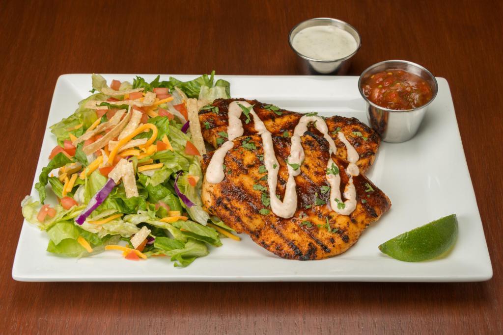 Ensenada Chicken Platter™ · Fire-grilled chicken breasts basted with authentic Mexican seasonings, topped with fresh salsa and creamy salsa-ranch. Served with a side salad.