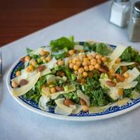 63. Kale Salad · Kale and romaine with golden raisins, toasted almonds, scallions and garbanzo beans with gra...