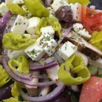 66. Santorini Salad · Romaine lettuce, tomato, red onion, banana peppers, Greek olives, cucumbers and feta cheese ...
