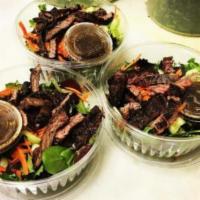 67. Skirt Steak Salad · Mixed greens with charbroiled skirt steak, cherry tomato, shaved carrots, cucumber and blue ...