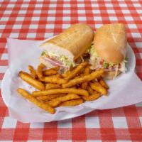 Submarine Sandwich · Ham, salami, provolone cheese, lettuce, tomatoes, mayo, mustard, and italian dressing  