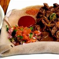 Awaze Tibs · Beef cubes. Sauteed with onion, garlic, jalapeño pepper red chili pepper purified Ethiopian ...