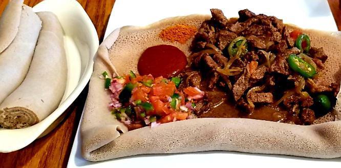 Awaze Tibs · Beef cubes. Sauteed with onion, garlic, jalapeño pepper red chili pepper purified Ethiopian butter served with Injera