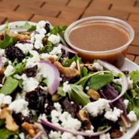 Cherry Walnut Salad · Mixed greens with dried cherries, red onions, goat cheese, walnuts, and raspberry viniagrette.