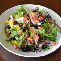 The Greek Salad · Mixed greens, red onions, black olives, banana peppers, Roma tomatoes, feta cheese, and choi...