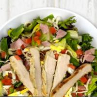 Chopped Cobb Salad · Mixed greens, grilled chicken breast, ham, chopped egg, bacon, mozzarella, tomatoes, crostin...