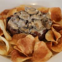 Filet Mignon  · 8 oz. Tenderloin served with a succulent Mushroom Sauce and sliced fried Potatoes 
