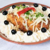Bacalhau à Old Lisbon · Lightly breaded Codfish served with mashed Potatoes, Olive Oil, Onions and Garlic Sauce