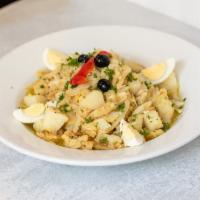 Bacalhau à Gomes Sà · Shredded codfish mixed with steamed Potatoes, boiled Eggs, Garlic, Onions and topped with Ol...