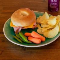 Bagel Sandwich · Toasted bagel sandwich with your choice of meat and cheese. Served with a bag of chips and f...