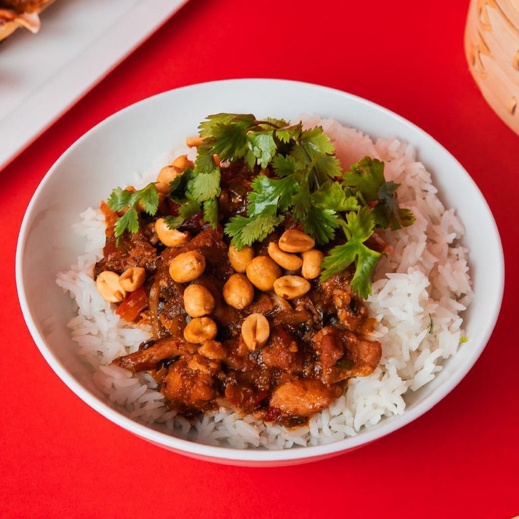 Spicy Kung Pao Chicken Bowl · Tender chicken that is cooked in a sweet and spicy sichuan chili-soy sauce, served on jasmine white rice.