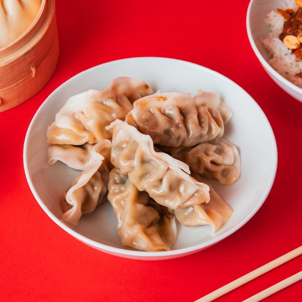 8 Pack Dumplings · Steamed with your choice of filling between Green Vegetable and Ginger Chicken.