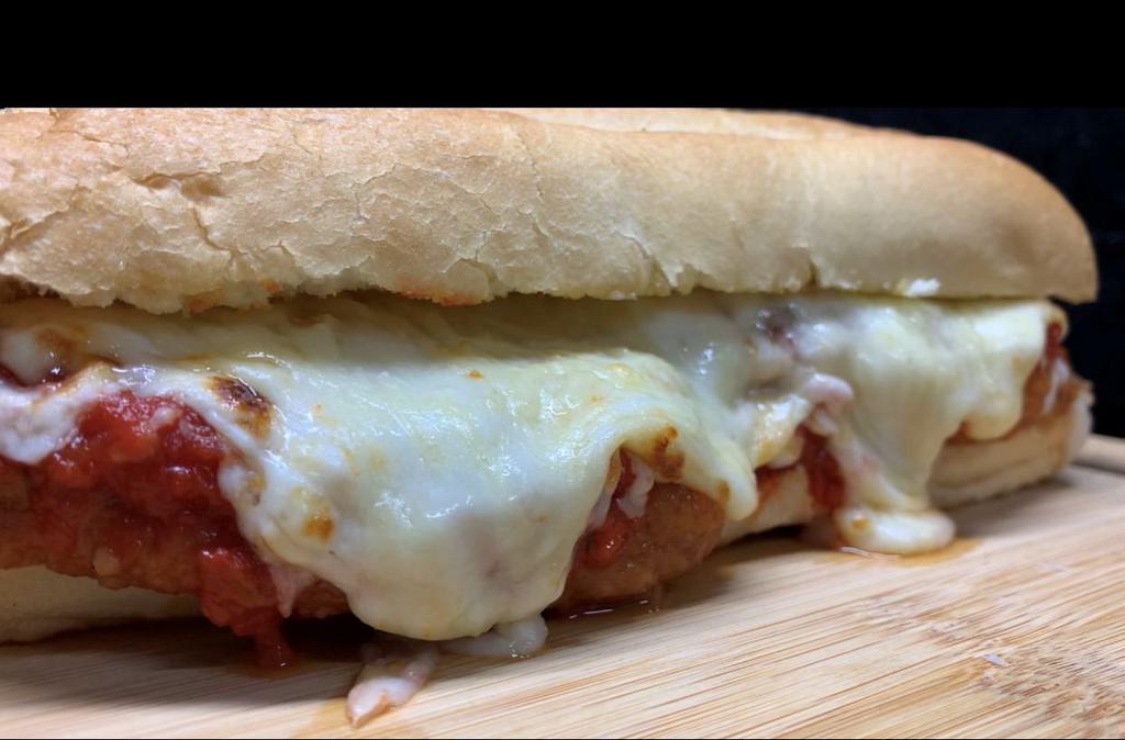 DOUBLE CHICKEN PARMESAN · Hope you're hungry!  We have two breaded white meat chicken patties, topped with our house red wine and basil marinara sauce.  Add some Mozarella and shredded Parmesan on a deli roll for a delicious Italian sandwich meal.  Delicious! Comes served with our Rosemary Fries, or you can upgrade to Garlic Parmesan fries!