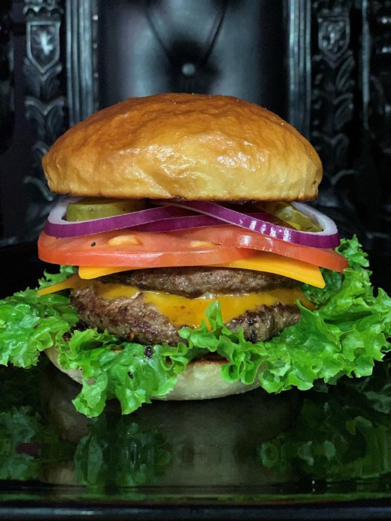 Heresy Burger · This burger rocks! Double meat, green leaf lettuce, tomato, red onion, pickles, served on a tall brioche bun. Comes with a side of our unique rosemary fries! Add cheese, +$1 
