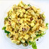 Chicken Salad · Curry chicken salad on a bed of mixed greens.