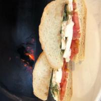 Caprese Sandwich · Roma tomato, fresh mozzarella, pesto aioli and balsamic vinaigrette on a Francese roll.