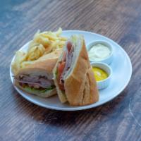 Ham and Cheese Sandwich · Black Forest ham, Swiss cheese, lettuce, tomato, mayonnaise and mustard on a baguette. Serve...
