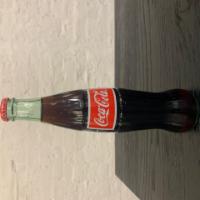Coke (Bottle) · Mexican Coke. 12oz bottle.  Made with real sugar.