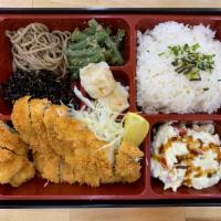 B02. Pork Tonkatsu Bento とんかつ弁当 · Main dish served with miso soup, house salad, rice and side dishes.