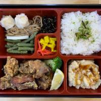 B08. Chicken Karaage Bento チキンから揚げ弁当 · Main dish served with miso soup, house salad, rice and side dishes.