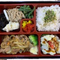 B11. Shogayaki Bento (Ginger Pork) 生姜焼き弁当 · Main dish served with miso soup, house salad, rice and side dishes.