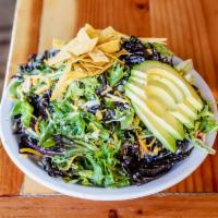 NW Fiesta Salad · Mixed greens, tortilla strips, black bean and corn salsa, red onions, tomatoes, cheese and a...