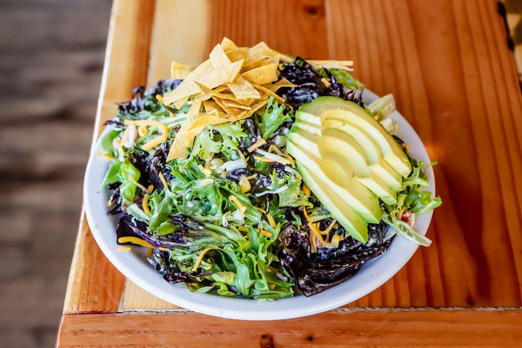 NW Fiesta Salad · Mixed greens, tortilla strips, black bean and corn salsa, red onions, tomatoes, cheese and avocado, tossed in our jalapeno lime ranch.