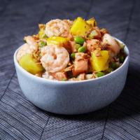 Citrus Bowl · Salmon and poached shrimp with mango, cucumbers, scallions, edamame, masago, and onion crisp...