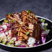 Kalua Pork Belly · Thinly sliced decadent braised pork belly over choice of base and salad