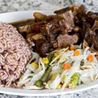 Oxtail Meal · For 4 people.This meal comes inclusive with rice and  peas/white rice and steamed cabbage/sa...