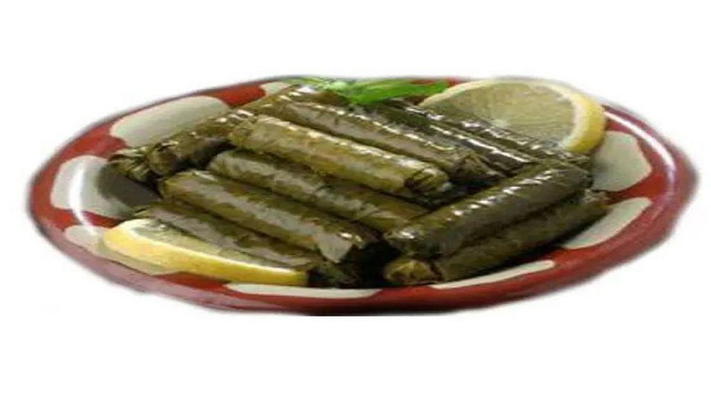 Dolma Grape Leaves Plate · Grape leaves stuffed with rice, tomatoes, onion and parsley cooked with seasoning.
