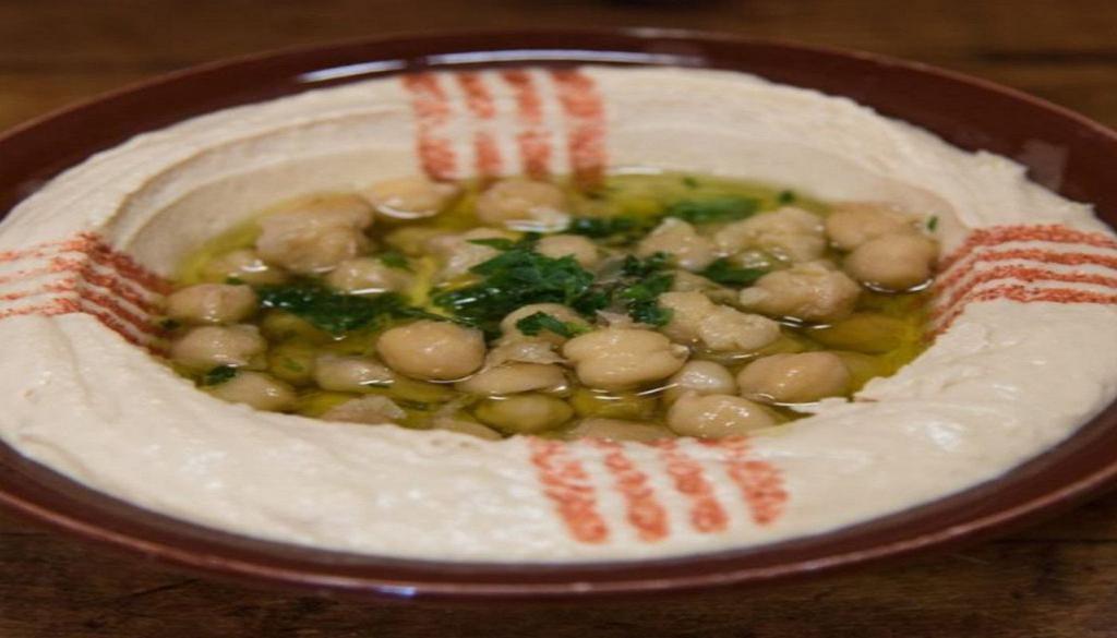 Hummus · A creamy dip of chickpeas, tahini, lemon and garlic. Topped with olive oil.