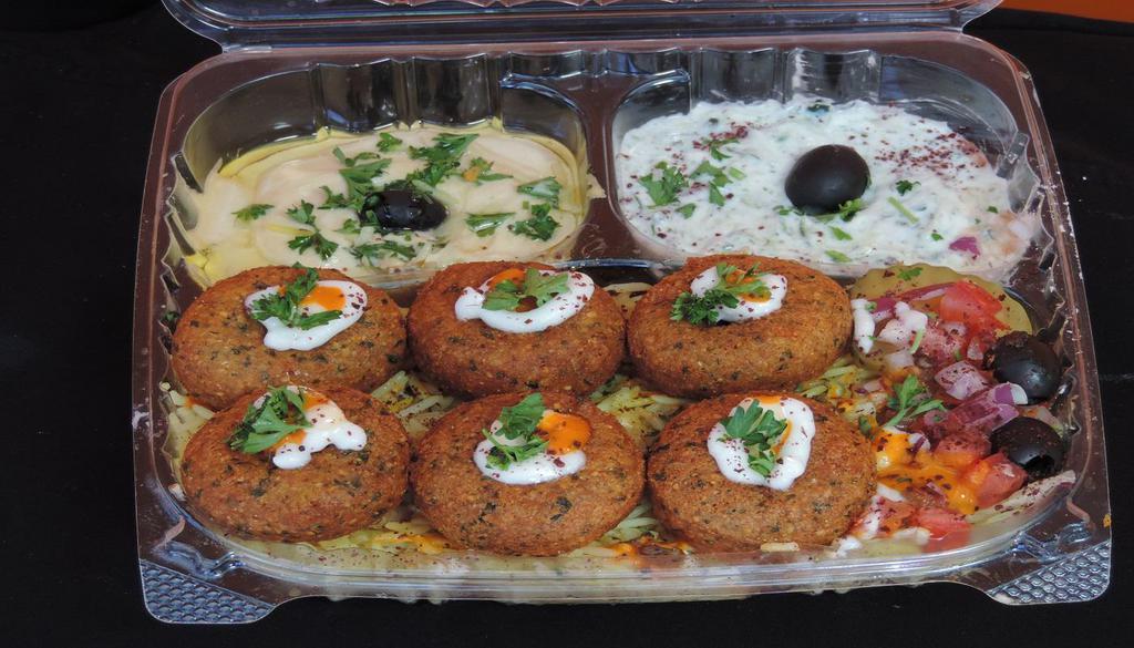 23. Falafel Over Rice Plate  · Chicken peas mixed with herbs, served with hummus, tahini sauce, salad and pickles, rice, tzatziki.