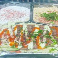 25. Beef Kabab Over Rice Plate · Beef, rice, mix salad, tzatziki, hummus mix spicy garlic sauce.