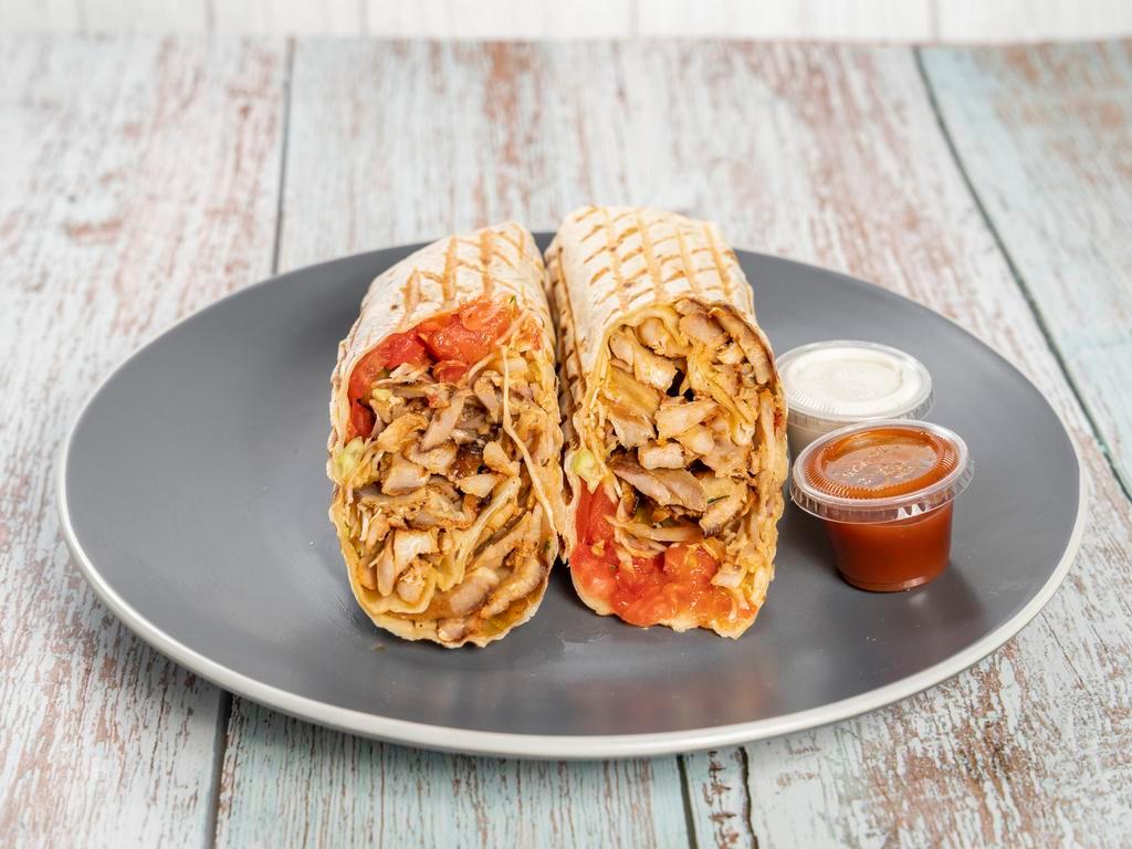 4. Chicken Shawarma · Wrap with onions, cabbage, tomato, cucumber, tomato sauce and white sauce.