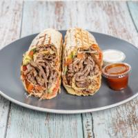 3. Meat Shawarma · Lamb and beef mix. Wrap with onion, cabbage, tomato, cucumber, tomato sauce and white sauce.