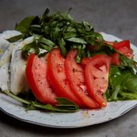 Chiffonade Basil, Roma Wedges Salad · Comes with S&P, crumbled feta, xvo over mixed greens.