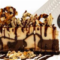 Cheesecake Challenge · NY-style cheesecake topped with salted potato chips, crushed pretzels & fudge sauce.