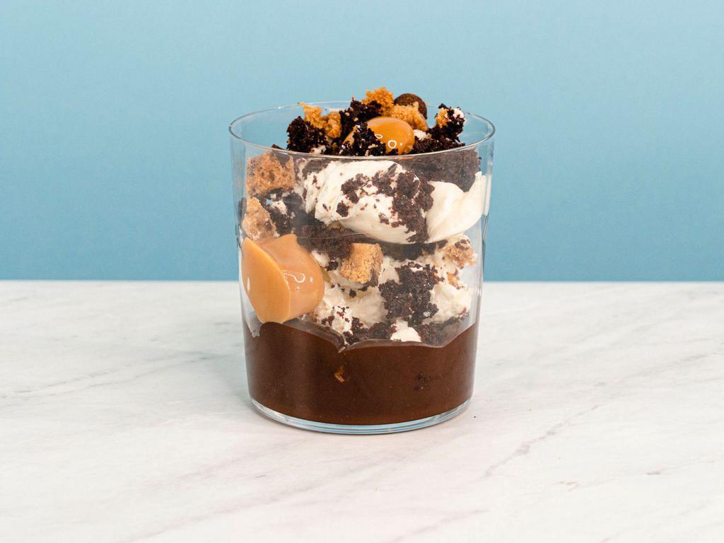 Cookies & Cream Mess · I scream, you scream, we all scream for Cookies & Cream! Whipped creme fraiche mixed with devil's food cake, chocolate chip cookies, and dulce de leche over a base of chocolate fudge. | Allergen: Milk, Egg, Tree Nuts