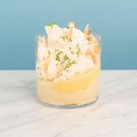 Roasted Coconut Mess · Enjoy our light and fluffy whipped creme fraiche layered with lime meringue, coconut cream, ...