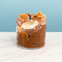 S'mores Pud · Decadent chocolate pudding topped with salty brown butter grahams, toasted nougat, caramel a...