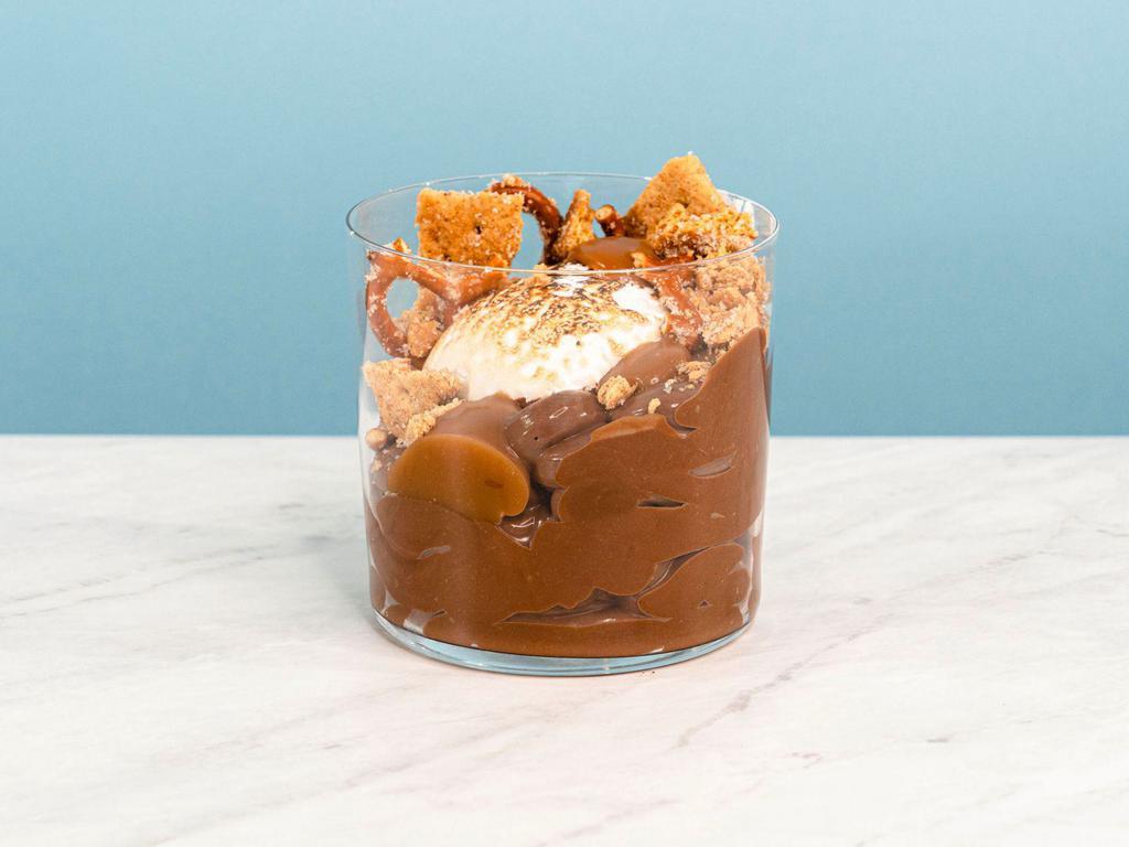 S'mores Pud · Decadent chocolate pudding topped with salty brown butter grahams, toasted nougat, caramel and a smooth honey-chocolate drizzle | Allergens: Milk, Egg