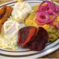 Tres Golpes · The 3 hits. Mashed green plantains with eggs, cheese and salami.
